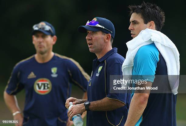 Mitchell Johnson of Australia watches on with coach Tim Nielsen during an Australian Twenty20 training session at Cricket Australia's Centre of...