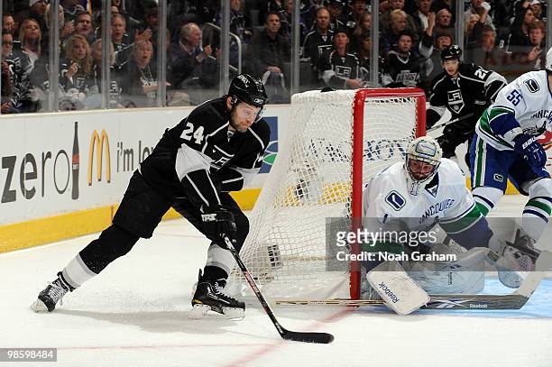 Alexander Frolov of the Los Angeles Kings tries to score against Roberto Luongo of the Vancouver Canucks in Game Four of the Western Conference...