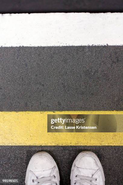 waiting at the tube - yellow line stock pictures, royalty-free photos & images