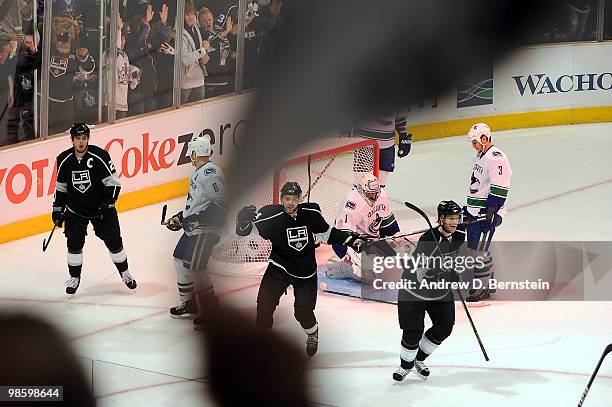 Dustin Brown, Alexander Frolov and Fredrik Modin of the Los Angeles Kings celebrate after a goal against Roberto Luongo of the Vancouver Canucks in...