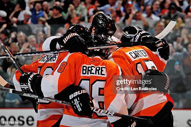 Mike Richards, Danny Briere, Jeff Carter and Chris Pronger of the Philadelphia Flyers celebrate Carter's third period goal against the New Jersey...