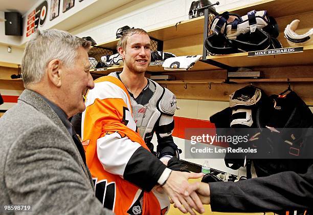 Jeff Carter of the Philadelphia Flyers greats some guests in the locker room after defeating the New Jersey Devils 4-1 in Game Four of the Eastern...