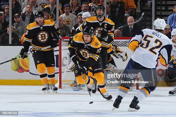 Milan Lucic of the Boston Bruins skates with the puck against the Buffalo Sabres in Game Four of the Eastern Conference Quarterfinals during the 2010...