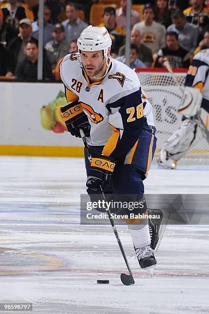 Paul Gaustad of the Buffalo Sabres skates with the puck against the Boston Bruins in Game Four of the Eastern Conference Quarterfinals during the...