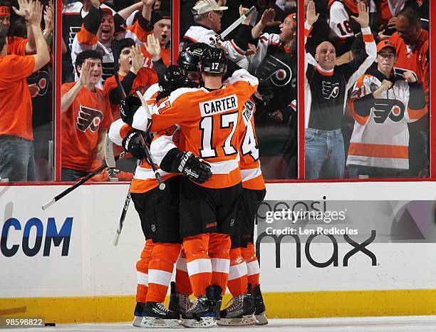 Jeff Carter of the Philadelphia Flyers celebrates his second period goal with his teammates against the New Jersey Devils to give the Flyers a 3-1...