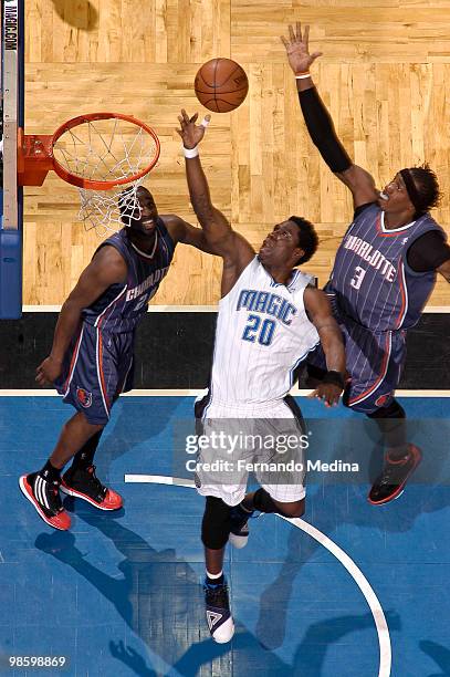 Mickael Pietrus of the Orlando Magic shoots against Gerald Wallace of the Charlotte Bobcats in Game Two of the Eastern Conference Quarterfinals...