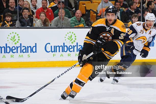 Patrice Bergeron of the Boston Bruins watches the play against the Buffalo Sabres in Game Four of the Eastern Conference Quarterfinals during the...