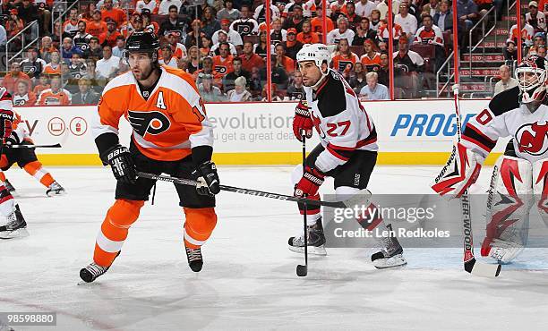 Mike Mottau and Martin Brodeur of the New Jersey Devils defend against Simon Gagne of the Philadelphia Flyers in Game Four of the Eastern Conference...