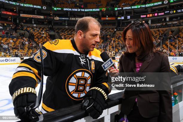 Mark Recchi of the Boston Bruins gets interviewed on NESN during warm-ups before the game against the Buffalo Sabres in Game Four of the Eastern...