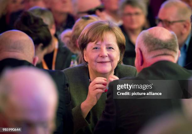 German Chancellor and chairwoman of the Christian Democratic Union , Angela Merkel sits opposite member of the Bundestag, Eckhardt Rehberg during the...