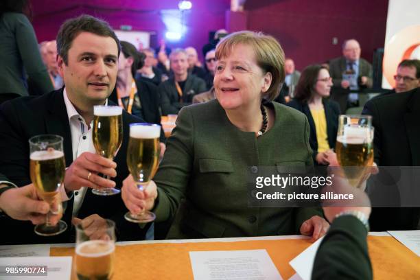 German Chancellor and chairwoman of the Christian Democratic Union , Angela Merkel sits next to the chairman of Mecklenburg-Vorpommern's CDU, Vincent...