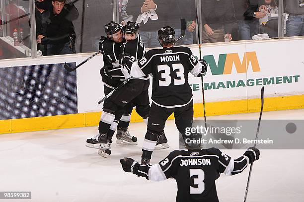 Drew Doughty, Dustin Brown, Fredrik Modin and Jack Johnson of the Los Angeles Kings celebrate after a goal against the Vancouver Canucks in Game Four...