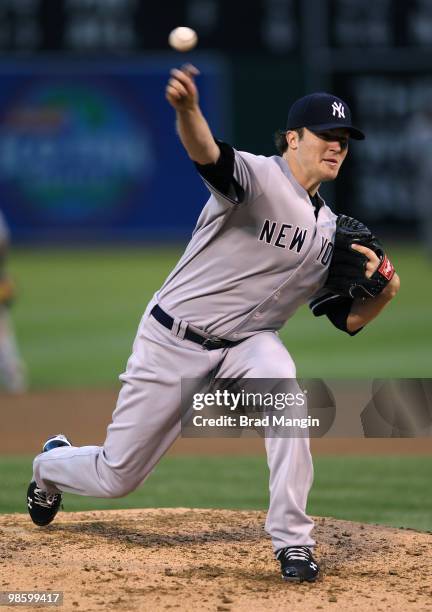 Phil Hughes of the New York Yankees pitches against the Oakland Athletics during the game at the Oakland-Alameda County Coliseum on April 21, 2010 in...