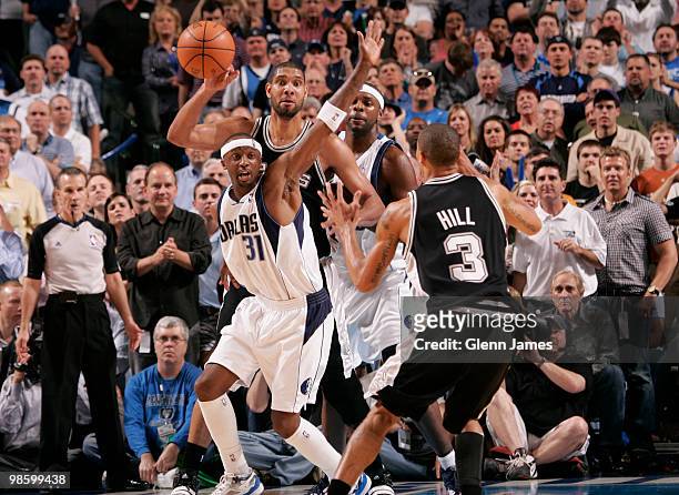 Tim Duncan of the San Antonio Spurs looks to pass out of a double team against Jason Terry and Brendan Haywood of the Dallas Mavericks in Game Two of...