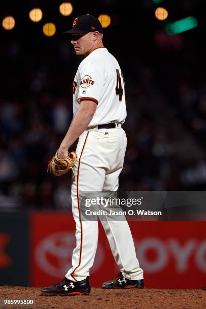 Mark Melancon of the San Francisco Giants stands on the pitchers mound against the San Diego Padres during the ninth inning at AT&T Park on June 21,...