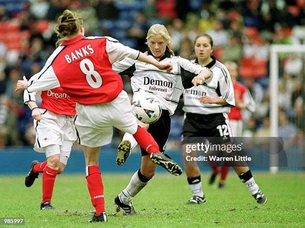 Katie Chapman of Fulham is challenged by Angela Banks of Arsenal during the AXA FA Women's Cup Final between Arsenal and Fulham played at Selhurst...