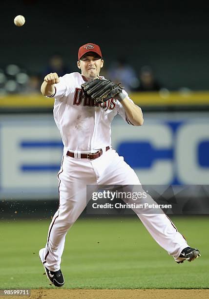 Infielder Stephen Drew of the Arizona Diamondbacks fields a ground ball out against the St. Louis Cardinals during the Major League Baseball game at...