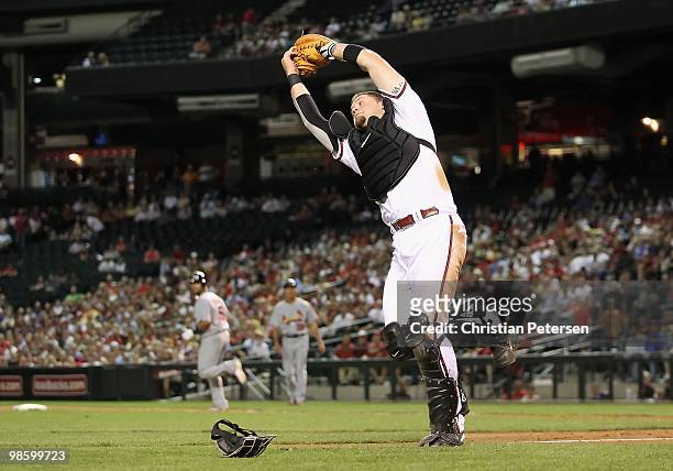 Catcher Chris Snyder of the Arizona Diamondbacks catches a pop fly out against the St. Louis Cardinals during the Major League Baseball game at Chase...