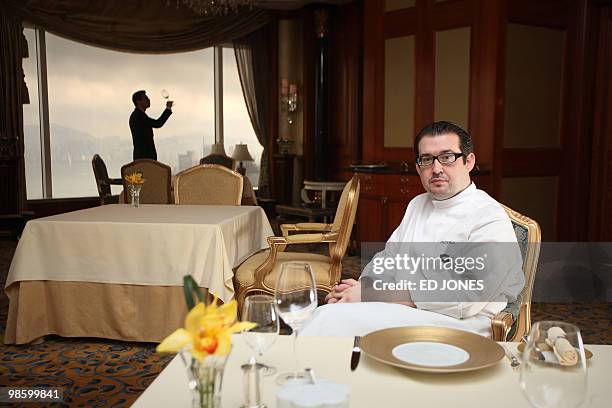 Chef Frederic Chabert from France sits in a dining room of the Petrus restaurant at the luxury Island Shangri-La hotel in Hong Kong on April 22,...