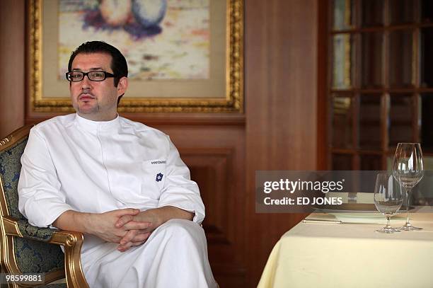 Chef Frederic Chabert from France sits in a dining room of the Petrus restaurant at the luxury Island Shangri-La hotel in Hong Kong on April 22,...