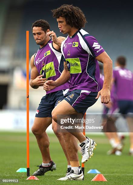 Hep Cahill and Kevin Proctor of the Storm limber up during a Melbourne Storm NRL training session at Visy Park on April 22, 2010 in Melbourne,...