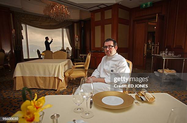 Chef Frederic Chabert of France sits in a dining room of the Petrus restaurant at the luxury Island Shangri-La hotel in Hong Kong on April 22, 2010....