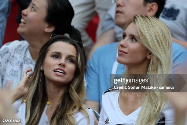 Christina Raphaella wife of Matthias Ginter of Germany and Scarlett Gartmann girlfriend of Marco Reus of Germany during the 2018 FIFA World Cup...