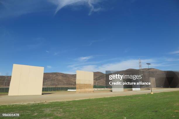 January 2018, Mexico, Tijuana: From Mexican side of the existing border fence, five prototypes of the wall can be seen, which US President Trump...