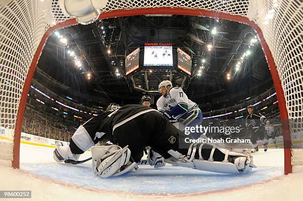 Ryan Kesler of the Vancouver Canucks reaches for the puck against Jonathan Quick of the Los Angeles Kings in Game Four of the Western Conference...