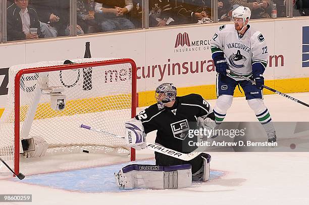 Jonathan Quick of the Los Angeles Kings and Daniel Sedin of the Vancouver Canucks watch as the puck goes in the net during Game Four of the Western...