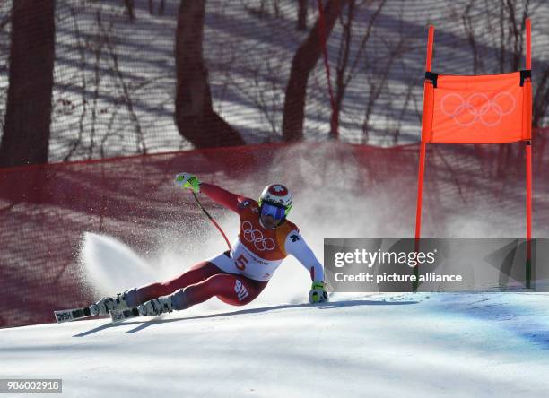 Beat Feuz from Switzerland skiing downhill during the men's alpine skiing event of the 2018 Winter Olympics in the Jeongseon Alpine Centre in...