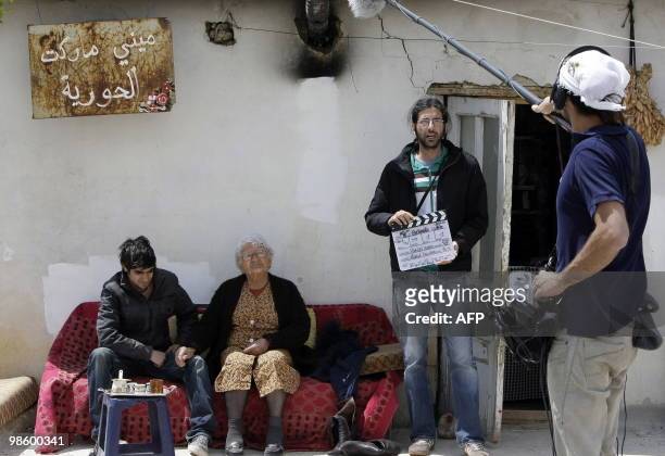 Lebanese actors Hassan Akil and Latifa Saade film an episode of the online series "Shankabout", in the Bekaa Valley village of Taalabaya on April 13,...