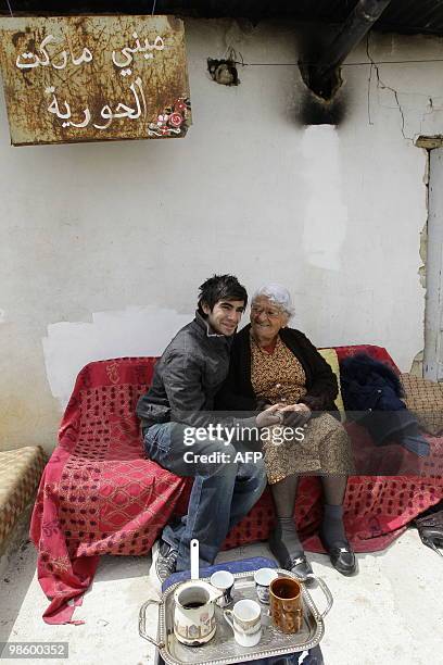 Lebanese actors Hassan Akil and Latifa Saade film an episode of the online series "Shankabout", in the Bekaa Valley village of Taalabaya on April 13,...