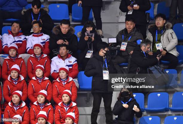 North Korean cheerleaders sitting in the tribunes during the figure skating free skate event of the 2018 Winter Olympics in the Gangneung Ice Arena...