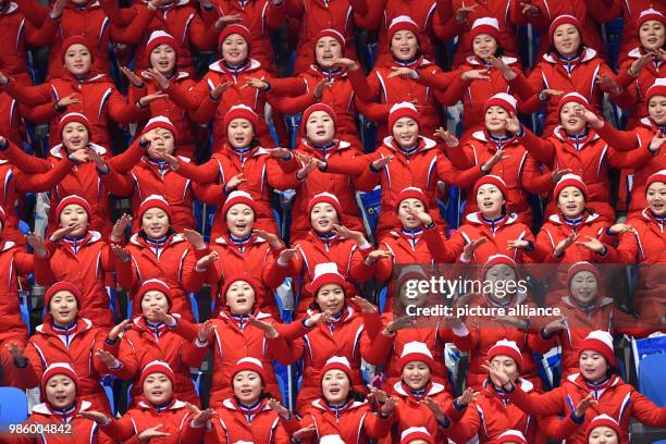 North Korean cheerleaders sitting in the tribunes during the figure skating free skate event of the 2018 Winter Olympics in the Gangneung Ice Arena...