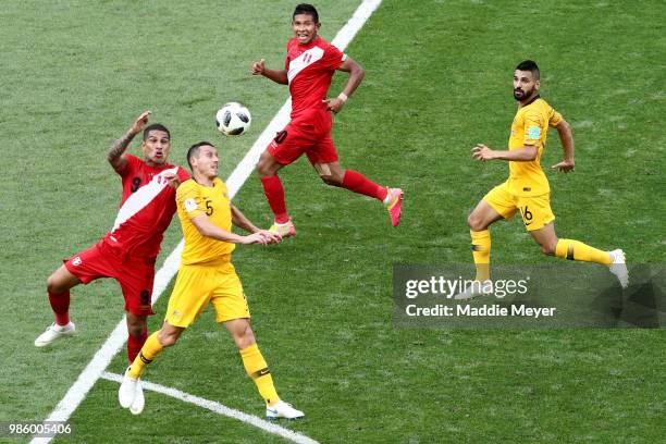 June 26: Jose Paolo Guerrero of Peru and Mark Milligan of Australia jump for a header during the 2018 FIFA World Cup Russia group C match between...