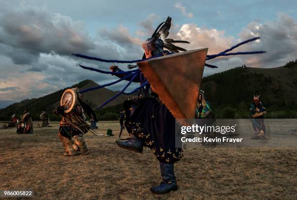 Mongolian Shaman or Buu, takes part in a fire ritual meant to summon spirits to mark the period of the Summer Solstice in the grasslands on June 22,...