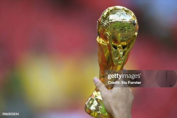 Replica FIFA World Cup trophy is held aloft during the 2018 FIFA World Cup Russia group E match between Serbia and Brazil at Spartak Stadium on June...