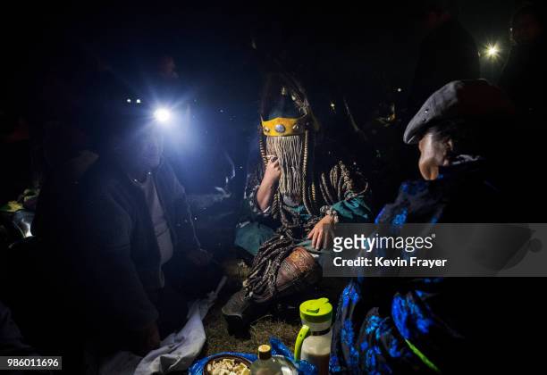 Mongolian Shaman or Buu, is seen in trance while being consulted by followers of Shamanism or Buu murgul at a fire ritual meant to summon spirits to...