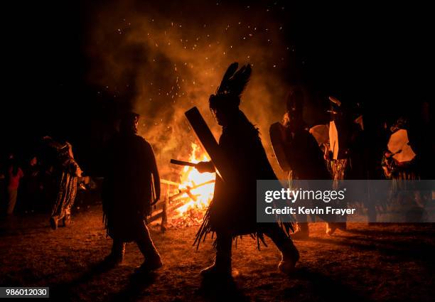 Mongolian Shamans or Buu, beat their drums as they take part in a fire ritual meant to summon spirits to mark the period of the Summer Solstice in...