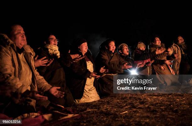 Mongolian followers of Shamanism, pray as they take part in a fire ritual meant to summon spirits on April 05, 2018 in Sukhbaatar, Selenge Province,...
