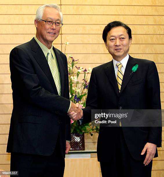 Singapore's Senior Minister Goh Chok Tong shakes hands with Japanese Prime Minister Yukio Hatoyama at Hatoyama's official residence, on April 22,...