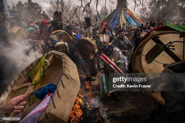 Mongolian Shamans or Buu, and their followers take part in a fire ritual meant to summon spirits at the Mother Tree on April 05, 2018 in Sukhbaatar,...