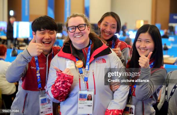 Volunteer Sabrina Ahn standing next to colleagues Toehun , Michelle and Youjung during the Olympic Games in Pyeongchang, South Korea, 14 February...