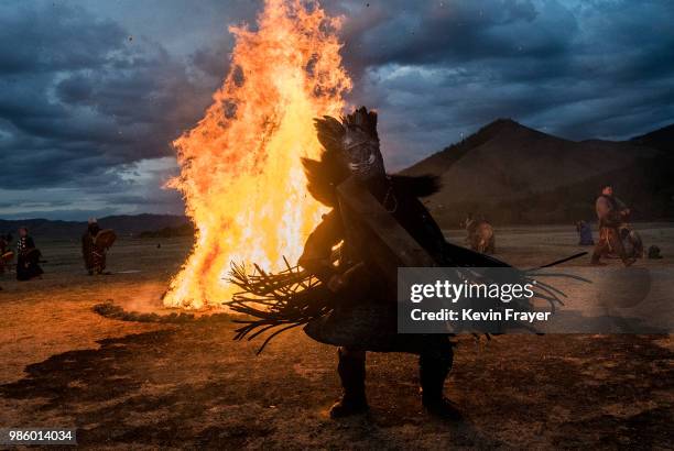 Mongolian Shamans or Buu, take part in a fire ritual meant to summon spirits to mark the period of the Summer Solstice in the grasslands on June 22,...