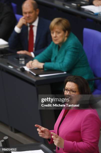 Andrea Nahles, Chairwoman of the SPD speaks as German Chancellor Angela Merkel and Finance Minister and vice Chancellor, Olaf Scholz listen after a...