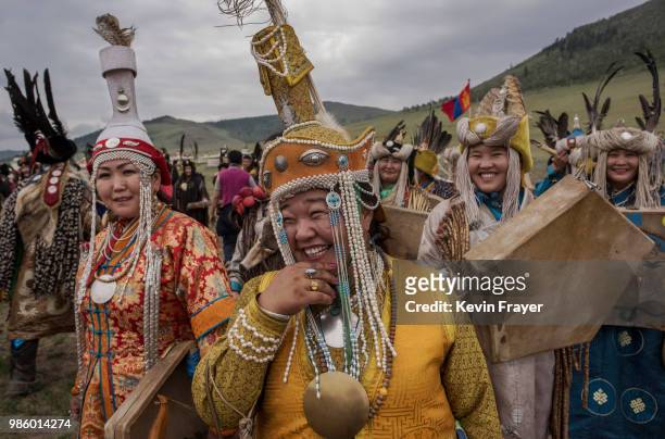 Mongolian Shamans or Buu, gather before a fire ritual meant to summon spirits to mark the period of the Summer Solstice on June 23, 2018 outside...