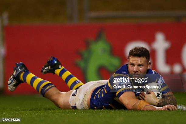 Nathan Brown of the Eels scores a try during the round 16 NRL match between the St George Illawarra Dragons and the Parramatta Eels at WIN Stadium on...