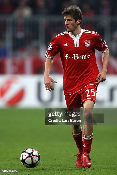 Thomas Mueller of Bayern runs with the ball during the UEFA Champions League semi final first leg match between FC Bayern Muenchen and Olympic Lyon...