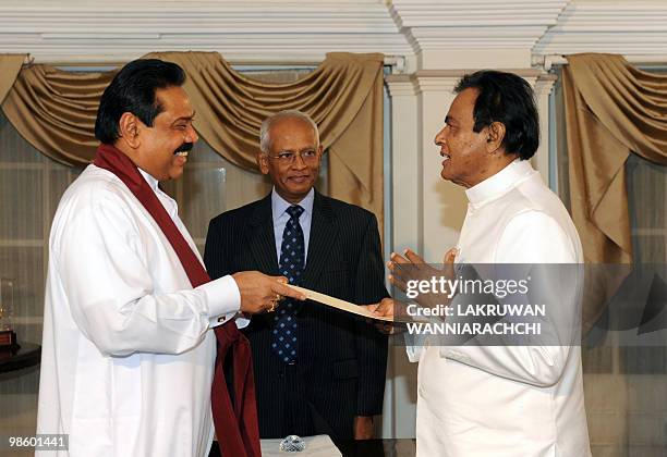 Sri Lankan President Mahinda Rajapakse administers the oath of office to new Sri Lankan Prime Minister D. M. Jayaratne in Colombo on April 21, 2010....